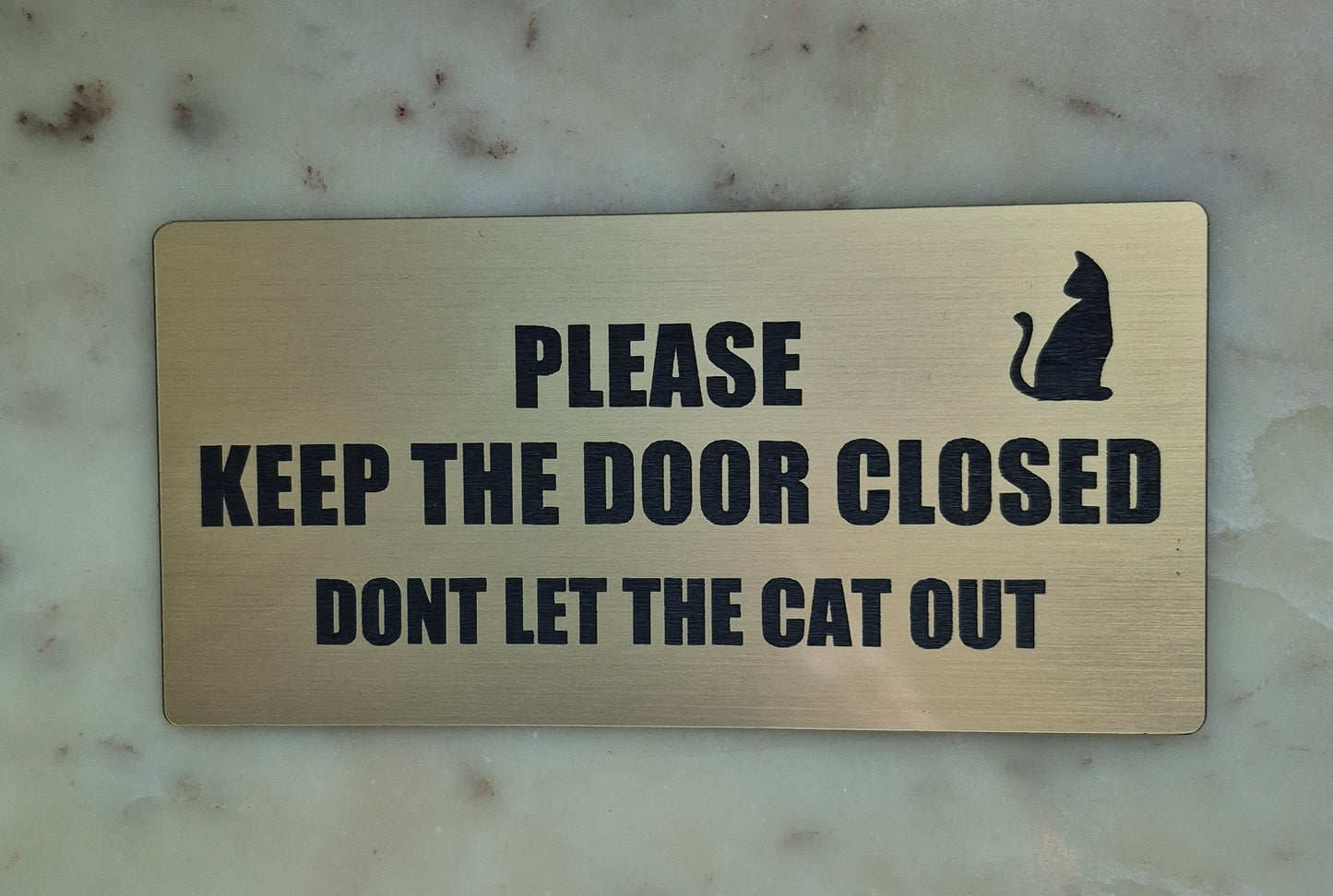 DONT LET THE CAT OUT /PLEASE KEEP THE DOOR CLOSE sign
