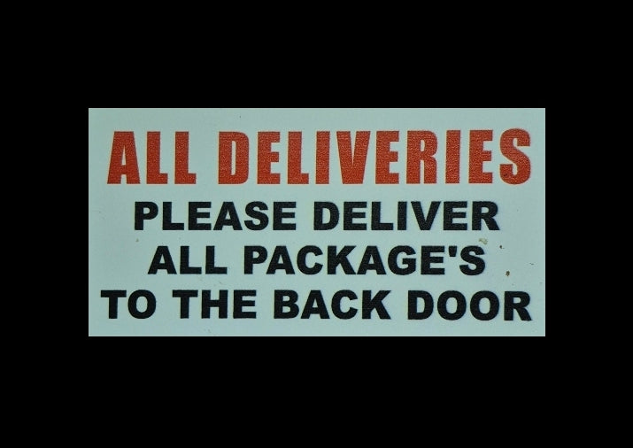 ALL DELIVERIES/ PLEASE DELIVER ALL PACKAGE'S TO THE BACKDOOR sign