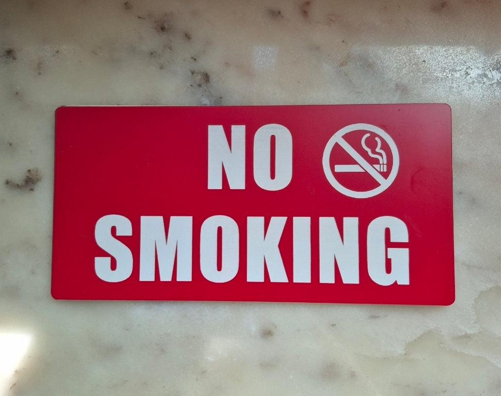 NO SMOKING sign