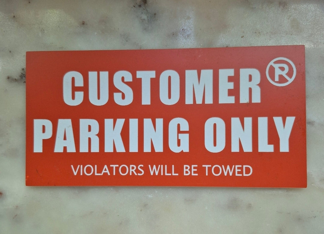 CUSTOMER PARKING/NO PARKING sign