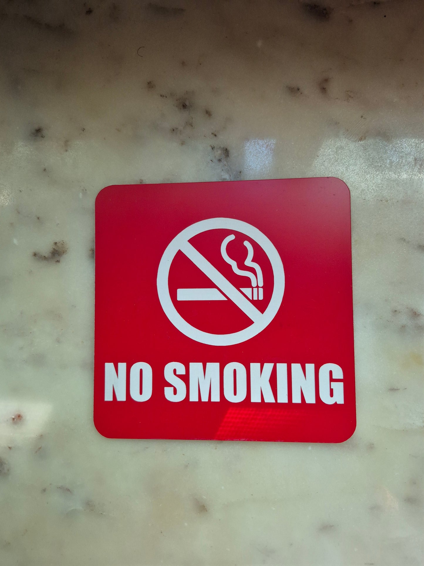 NO SMOKING sign